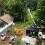 Tree removal with crane and other equipment