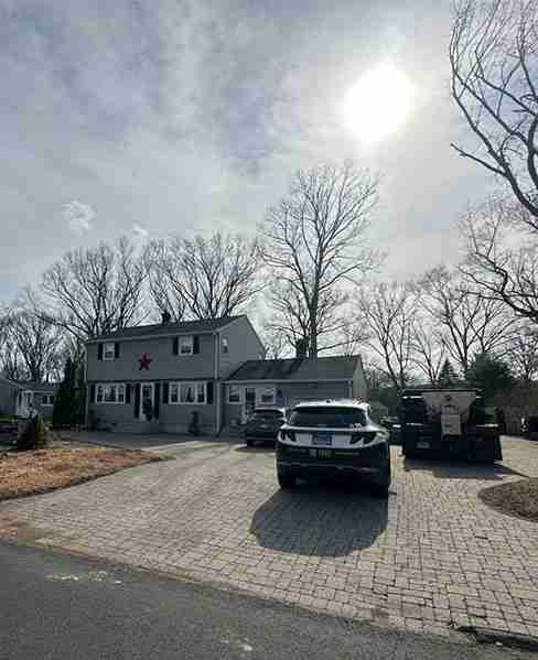 Front yard with sunlight after tree removal in Southington, CT.